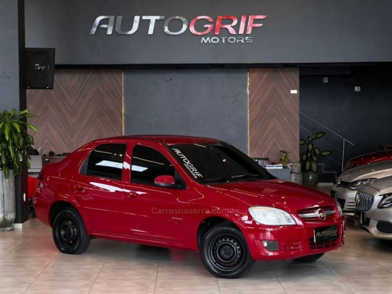 CHEVROLET - PRISMA - 2009/2010 - Vermelha - R$ 28.900,00